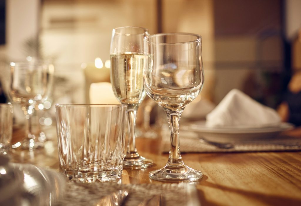 Drink, glass and dinner with party, celebration event with glassware, elegant and luxury in restaur